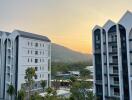 View of residential buildings with sunset in the background