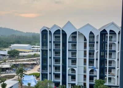 Modern apartment building with a scenic background