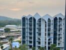 Modern apartment building with a scenic background