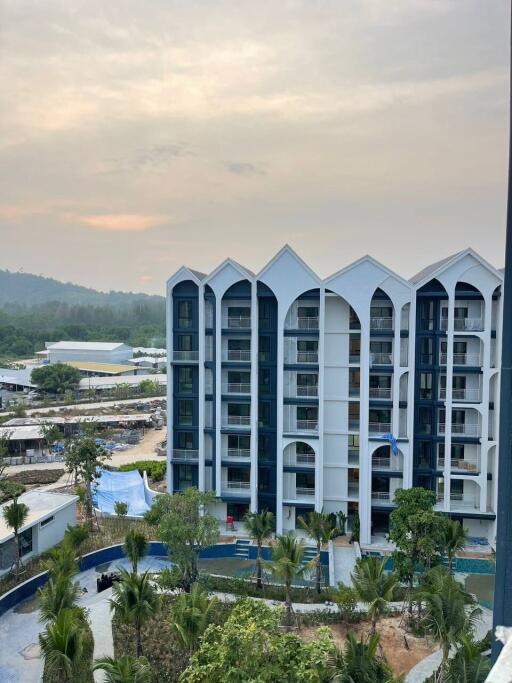 Modern apartment building with a scenic background