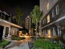 Night view of a residential complex with landscaped pathways