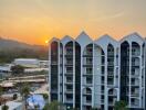 Modern apartment building with a scenic view at sunset