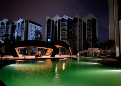 night view of swimming pool and modern residential buildings