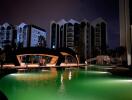 night view of swimming pool and modern residential buildings