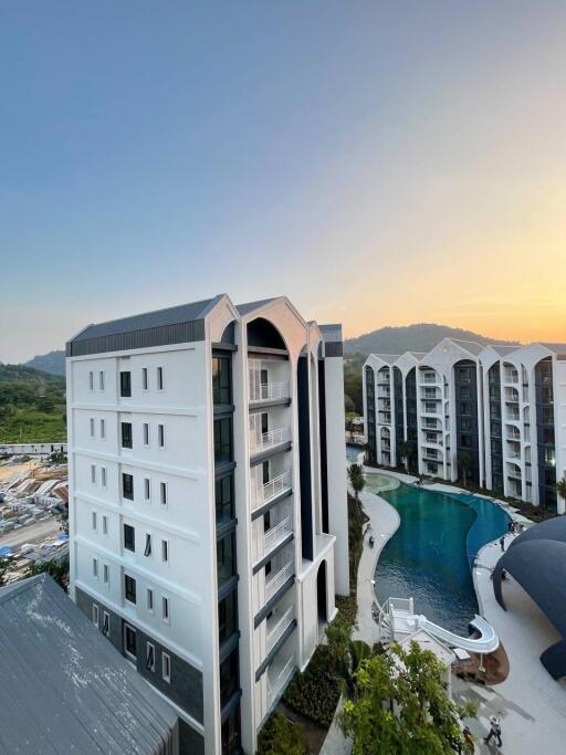 Exterior view of modern apartment buildings with a large swimming pool