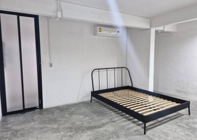 Minimalist bedroom with metal bed frame