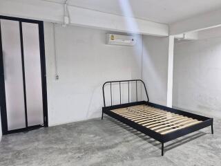 Minimalist bedroom with metal bed frame