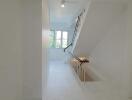 Bright staircase with window and handrail