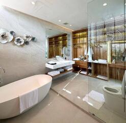 Modern bathroom with a bathtub, sink, and glass-enclosed shower