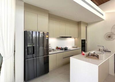 Modern kitchen with island counter and stainless steel appliances