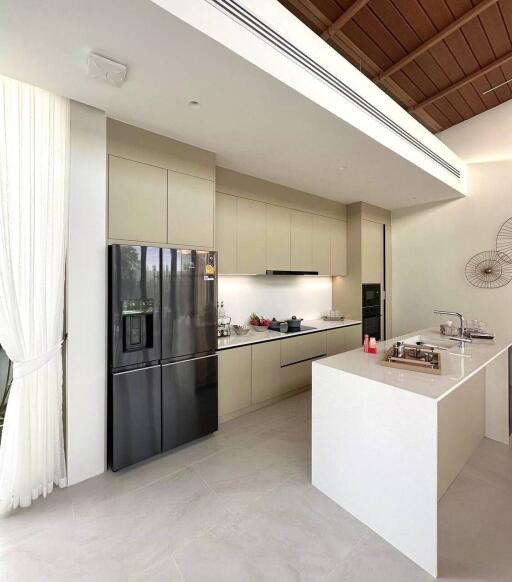 Modern kitchen with island counter and stainless steel appliances