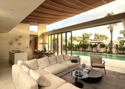 Spacious modern living area with pool view