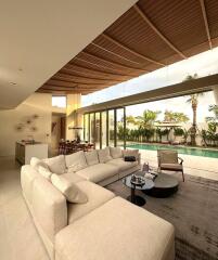 Spacious modern living area with pool view