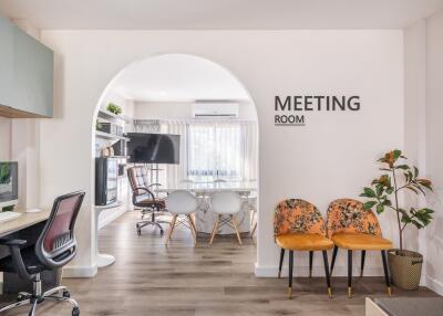 Modern meeting room with seating and office equipment