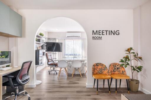 Modern meeting room with seating and office equipment