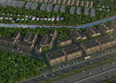 Aerial view of residential buildings surrounded by greenery