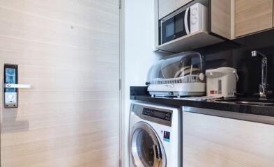 Compact kitchen area with appliances