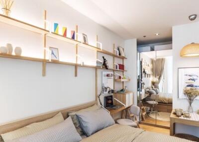 Cozy bedroom with modern decor and wall-mounted shelves