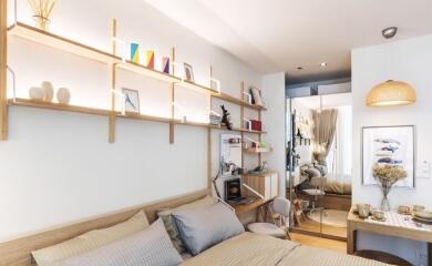 Cozy bedroom with modern decor and wall-mounted shelves