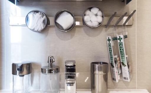 Bathroom counter with toiletries and dental products