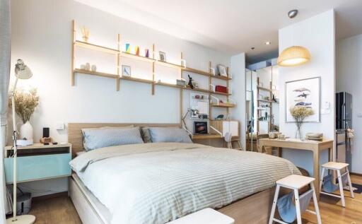 Modern bedroom with minimalist decor, wooden furniture, and shelving