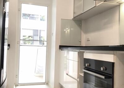 Modern kitchen with white cabinetry and high-end appliances