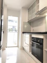 Modern kitchen with white cabinetry and high-end appliances