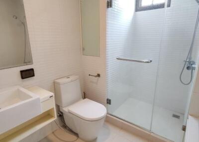 Modern bathroom with glass shower and toilet