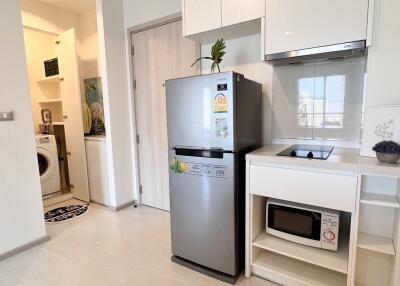 Modern kitchen with appliances and laundry area