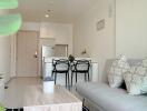 Modern living room with kitchen in the background