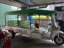 Three-wheeled vehicle parked in a garage