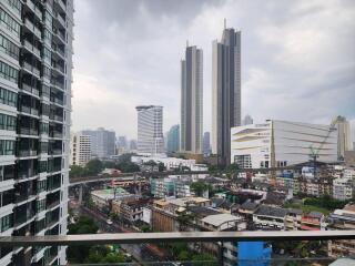 View of cityscape from a high-rise balcony