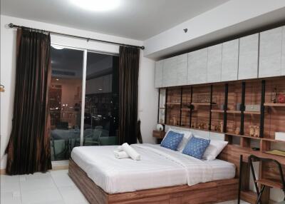 Bedroom with large glass door and balcony view