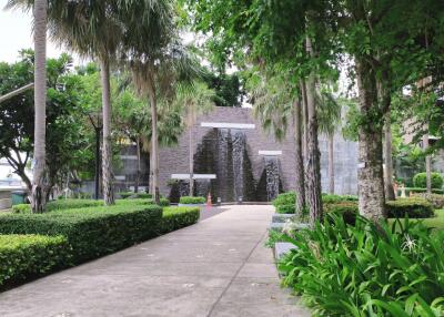 Well-maintained garden with a walking path and lush greenery