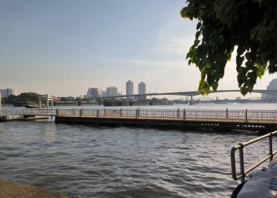 Riverside view with a bridge and cityscape