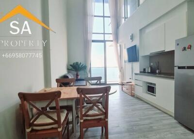 Modern kitchen and dining area with appliances and dining table