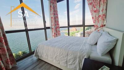 Bright bedroom with large windows and scenic view