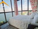 Bright bedroom with large windows and scenic view