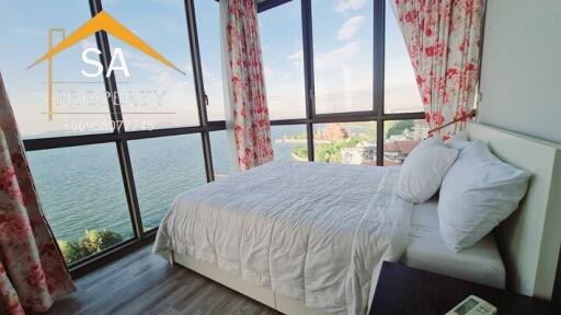 Bright bedroom with large windows and scenic view