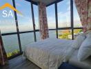 Bedroom with large windows and sea view