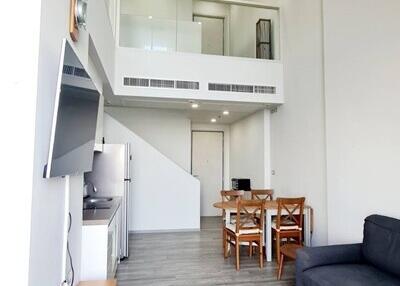 Modern living room with dining area and mezzanine