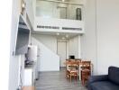 Modern living room with dining area and mezzanine