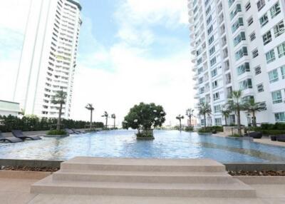 Outdoor pool area with surrounding buildings