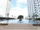 Outdoor pool area with surrounding buildings