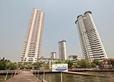 Exterior view of high-rise apartment buildings near waterfront