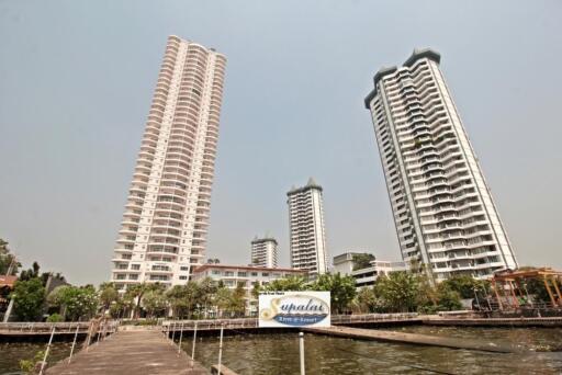 Exterior view of high-rise apartment buildings near waterfront