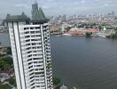 High-rise residential building with a river view and swimming pool