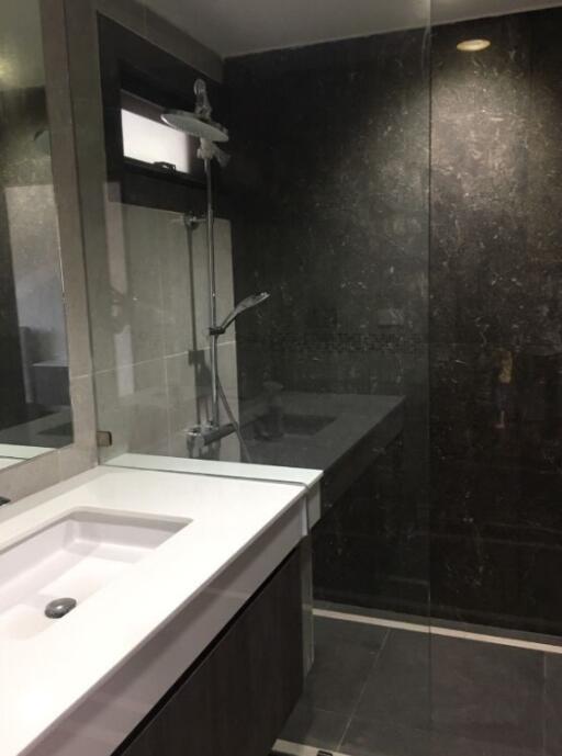 Modern bathroom with glass shower enclosure and sink