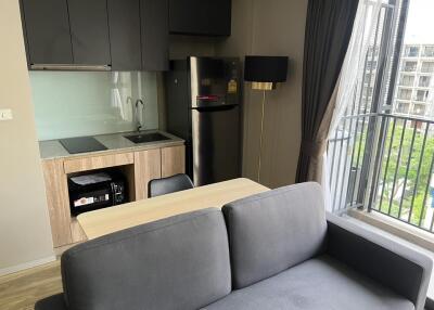 Modern kitchen with appliances and adjacent dining area