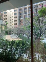 View of residential buildings and outdoor seating area